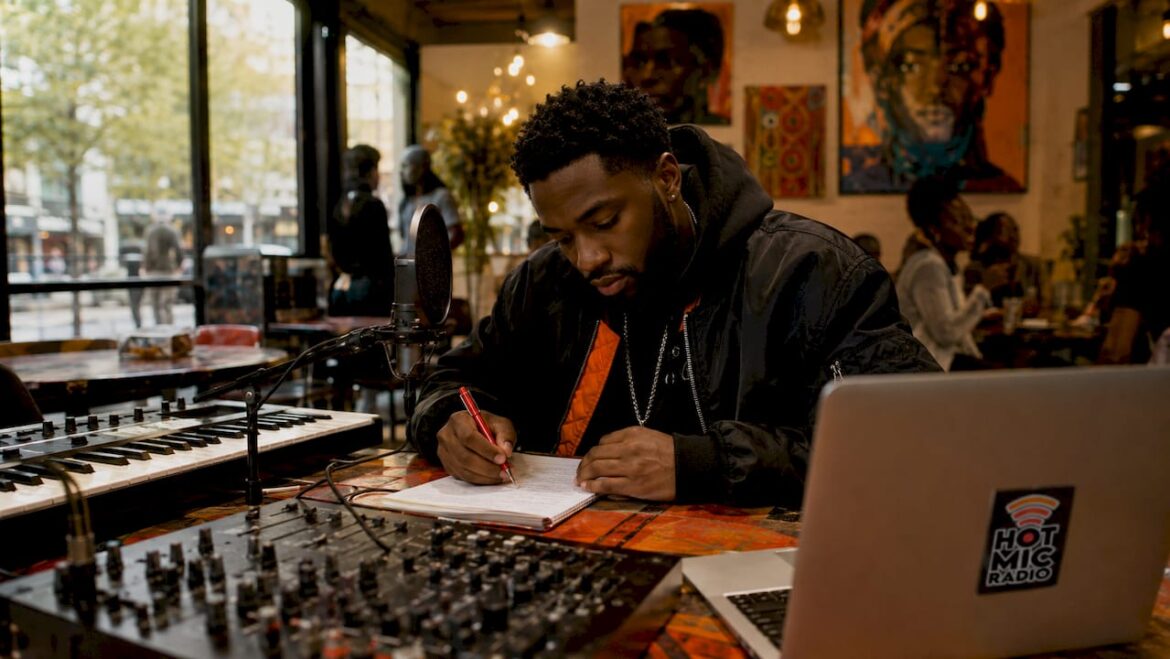 Hip hop lyricist writing lyrics in home studio