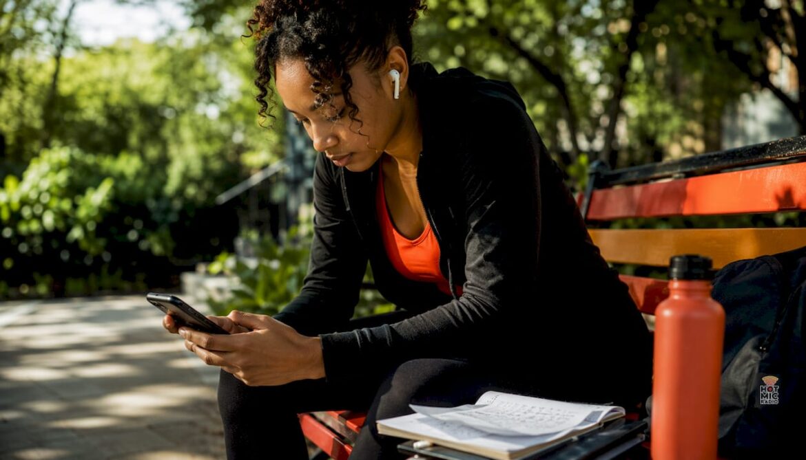 Young woman exploring R&B playlists on smartphone