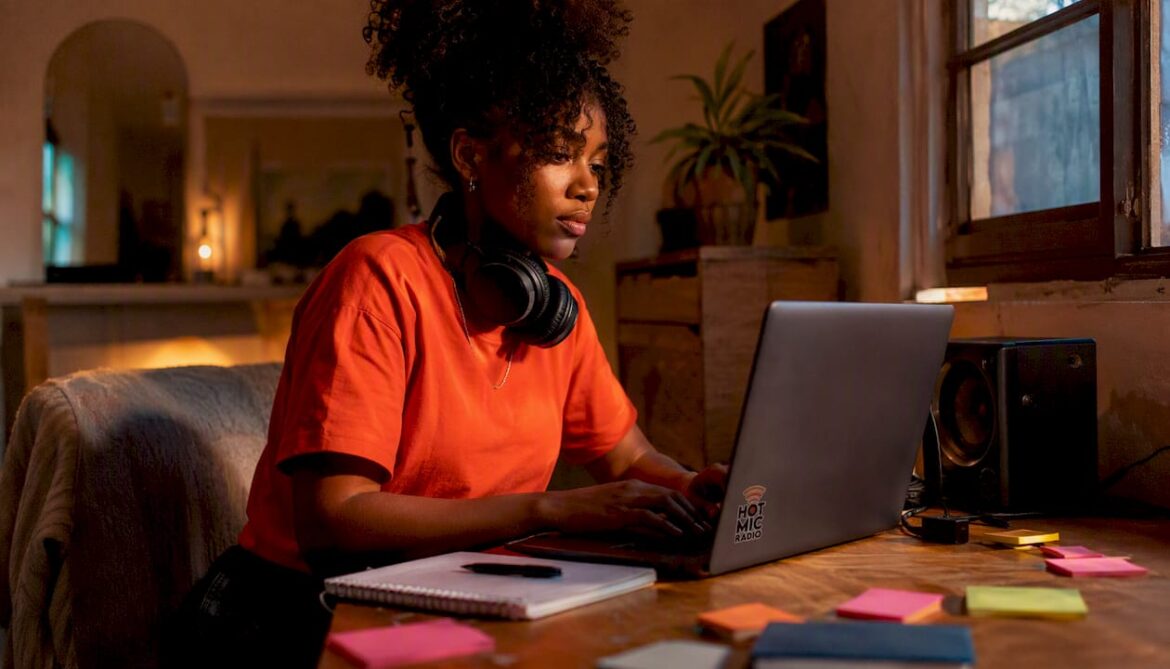 Young woman working on music in home studio