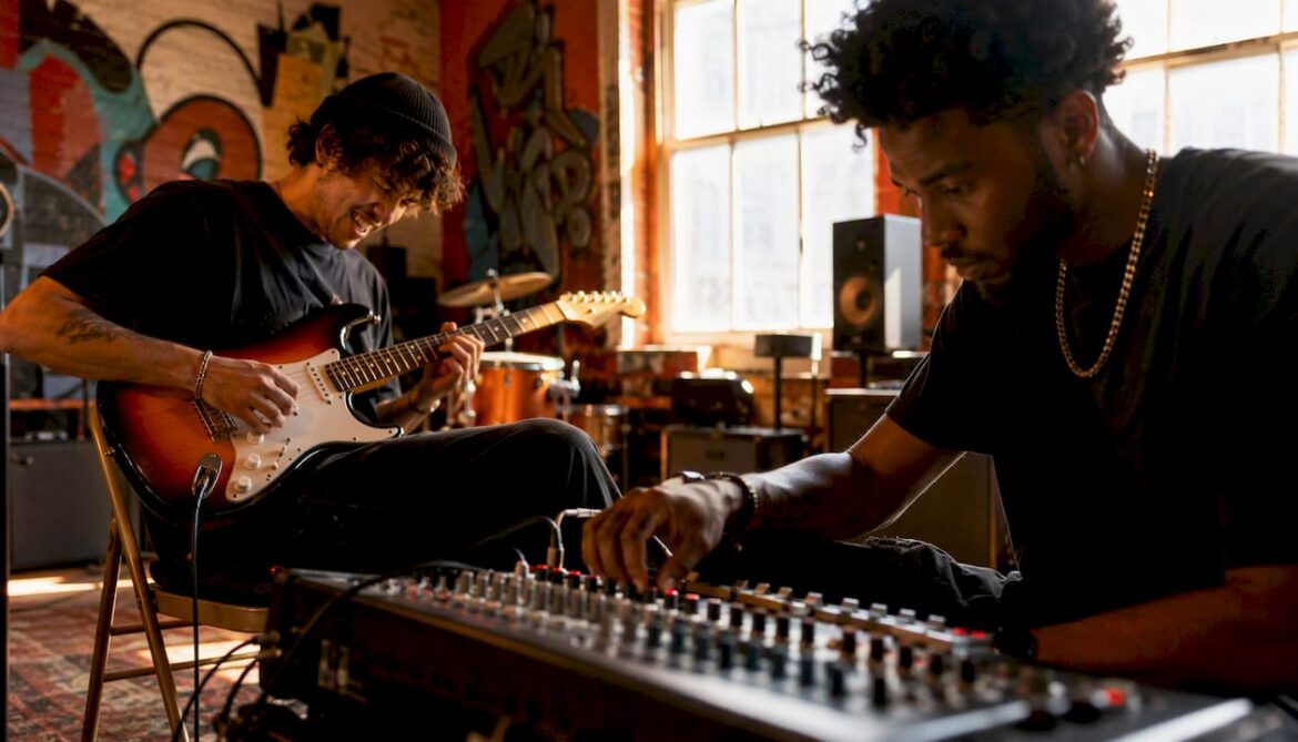 Artists collaborating in music studio