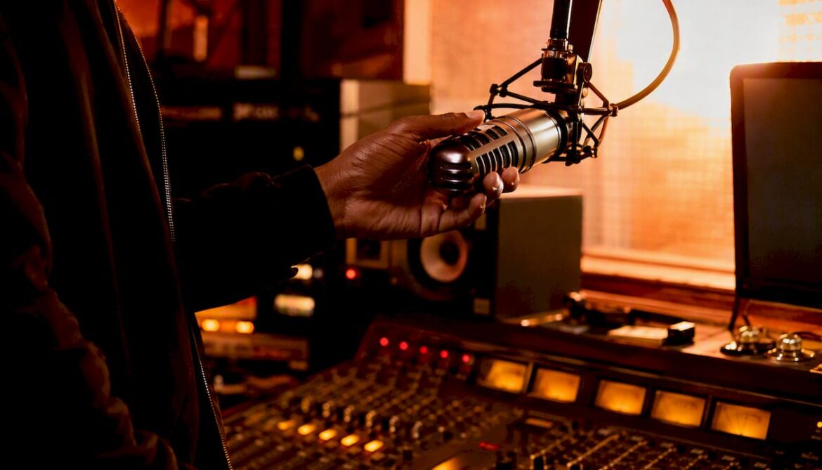 Hand dialing phone in radio studio