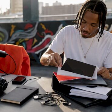Artist assembling independent press kit