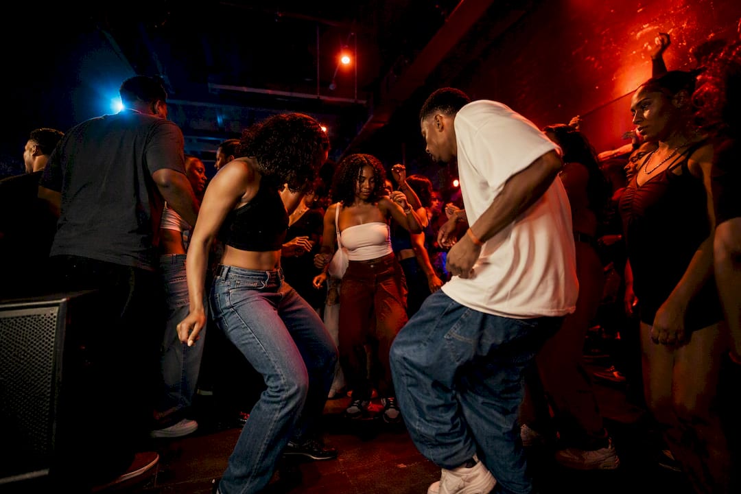 Dancers moving to Miami bass in club
