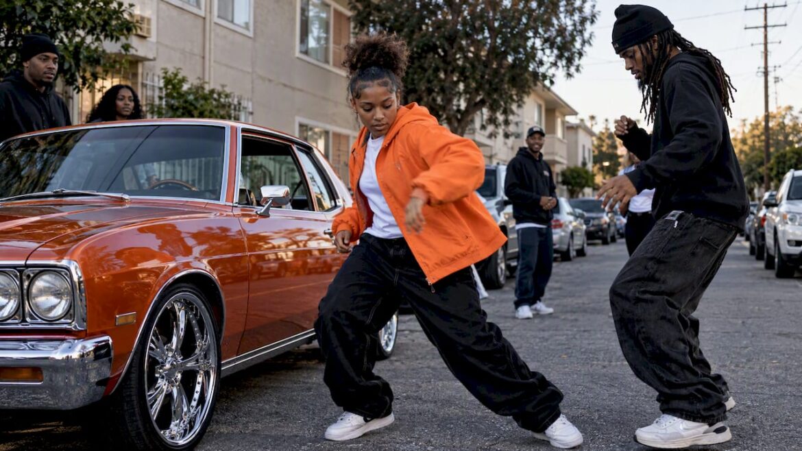 Oakland dancers gathered beside customized car