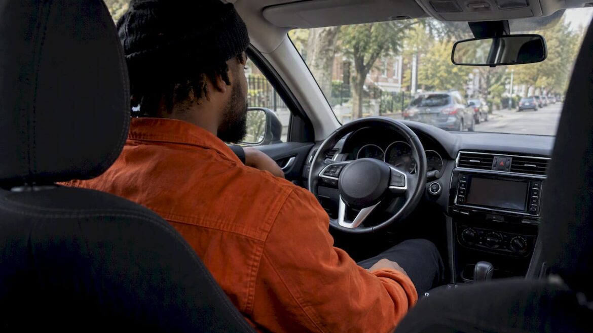 Artist listening to a mix in a parked car