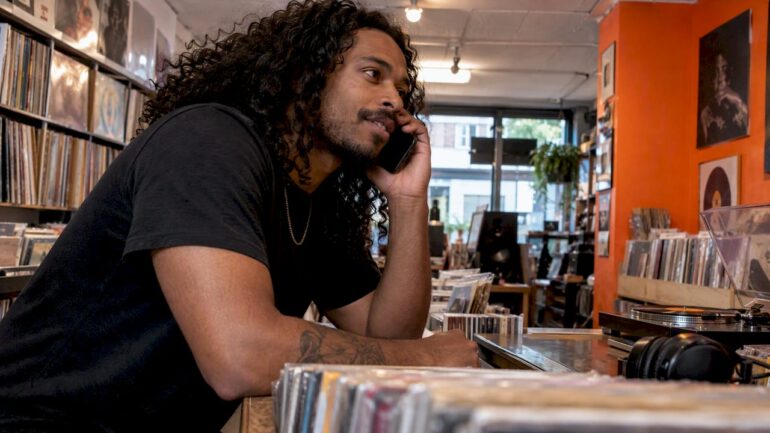 Fan calling a radio host from record shop